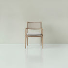 Josephine dining chair with curved backrest on oak frame