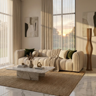 Bianca curved boucle sofa side view